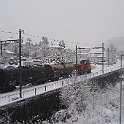 DSCF0221  Un long train de citernes dans la neige à Ittigen, tracté par une Bm 4/4