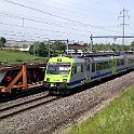 DSC14728  Navette RBDe 565 du BLS en service S3 croisant un train de transport de voitures neuves près de Zollkofen
