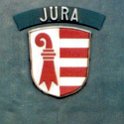 11483g  Ae 6/6 11483. Lors de la création du canton du Jura, on attribua le nom de Jura à la 11483 qui portait précédemment les armoiries de porrentruy. C'est la Re 4/4 II 11239 qui reçut l'écusson de Porrentruy en échange.