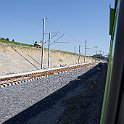 DSC10438  Travaux de pose de la voie entre la gare modernisée et la future entrée de tunnel.